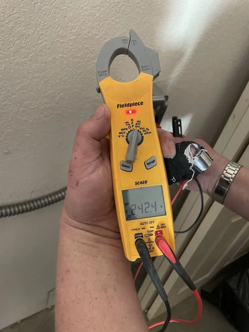 Voltage testing with clamp meter during Ceiling Fan Installation in Bartonsville